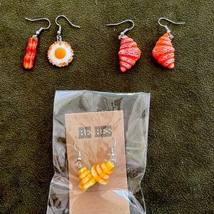 Three pairs novelty breakfast earrings: bacon/eggs, croissants, pancakes